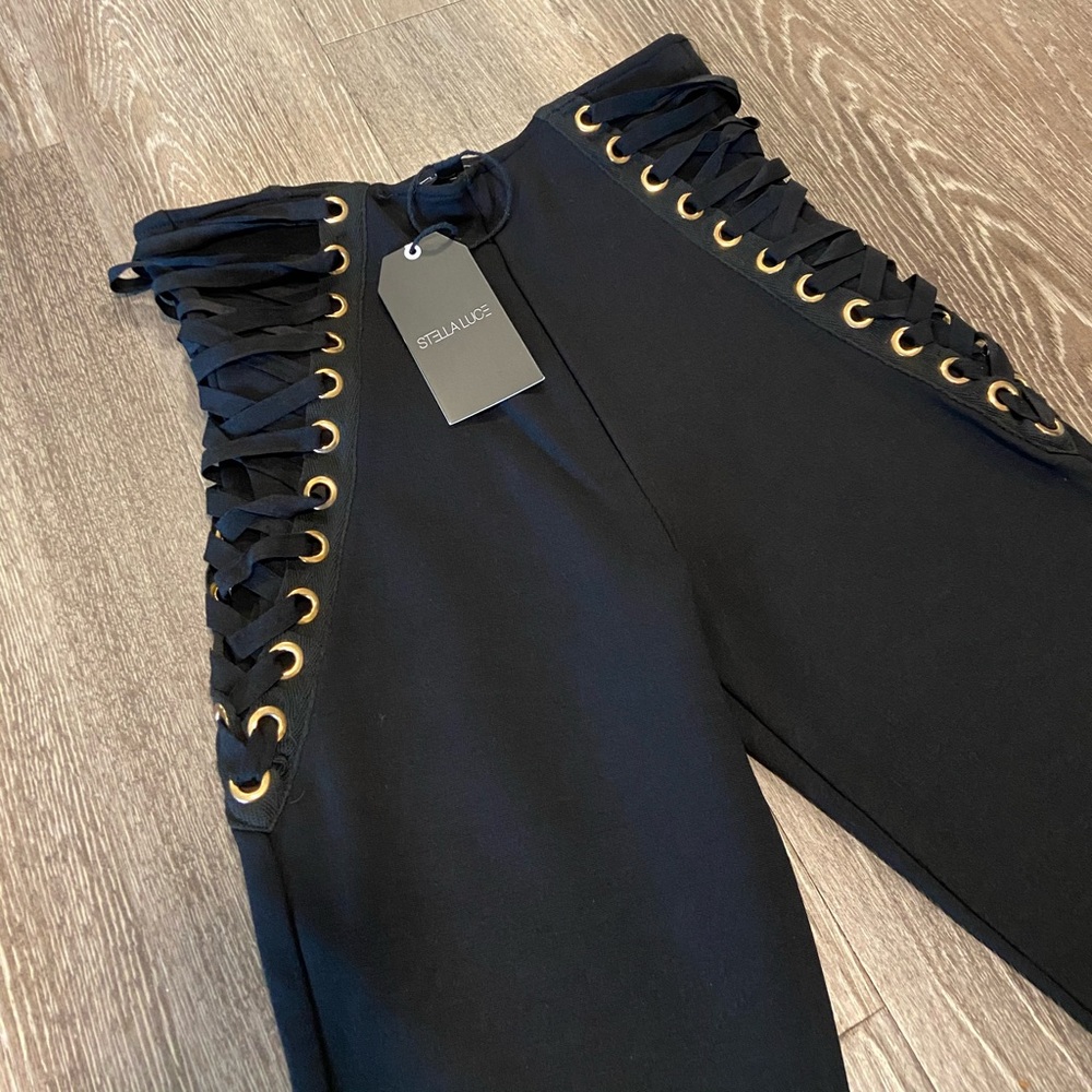 Black pants stretch with gold details.